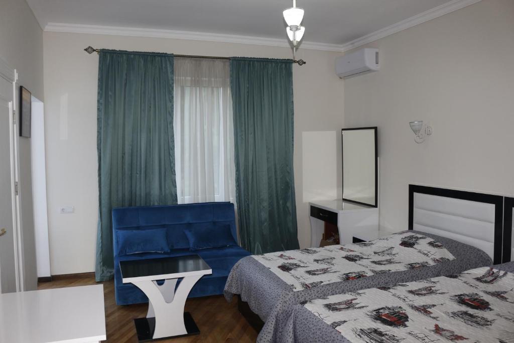 Postel nebo postele na pokoji v ubytování Guest House Sofia