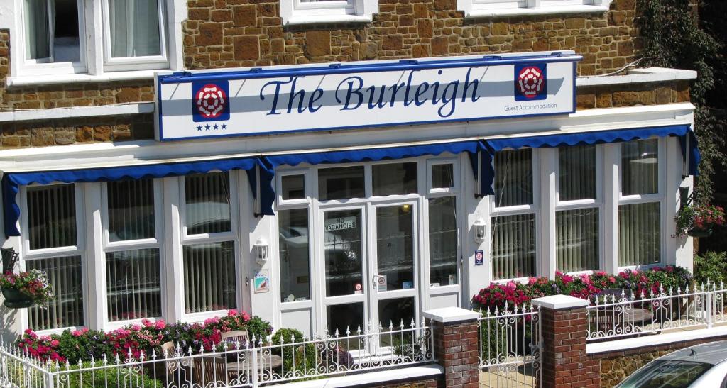 a building with a sign that reads theumbrella at The Burleigh in Hunstanton