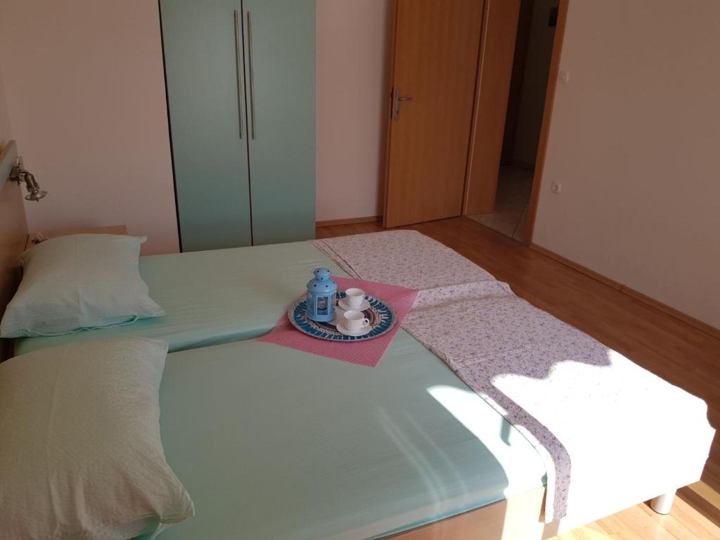 Postel nebo postele na pokoji v ubytování Apartmani Bambi