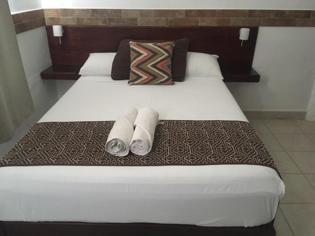 Postel nebo postele na pokoji v ubytování Hotel Tuparenda