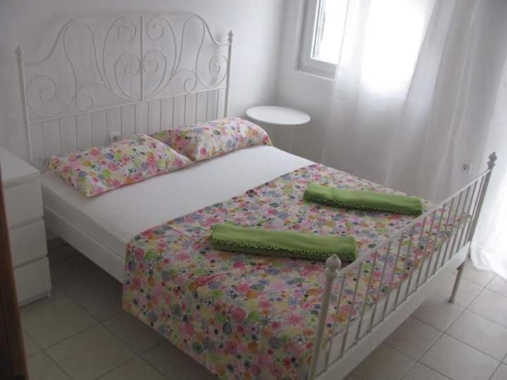 Postel nebo postele na pokoji v ubytování Apartmani Vukmanovic
