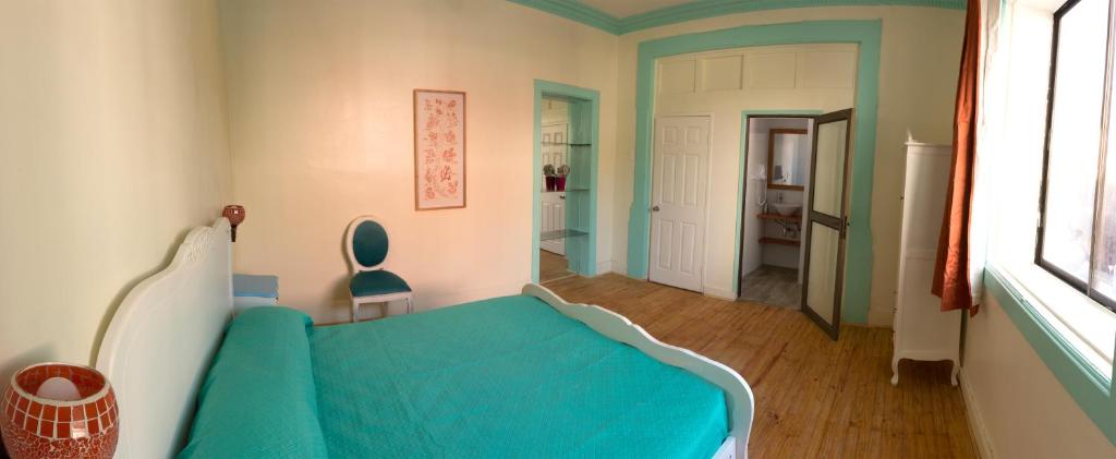 Postel nebo postele na pokoji v ubytování Hostal Casa Aborigen