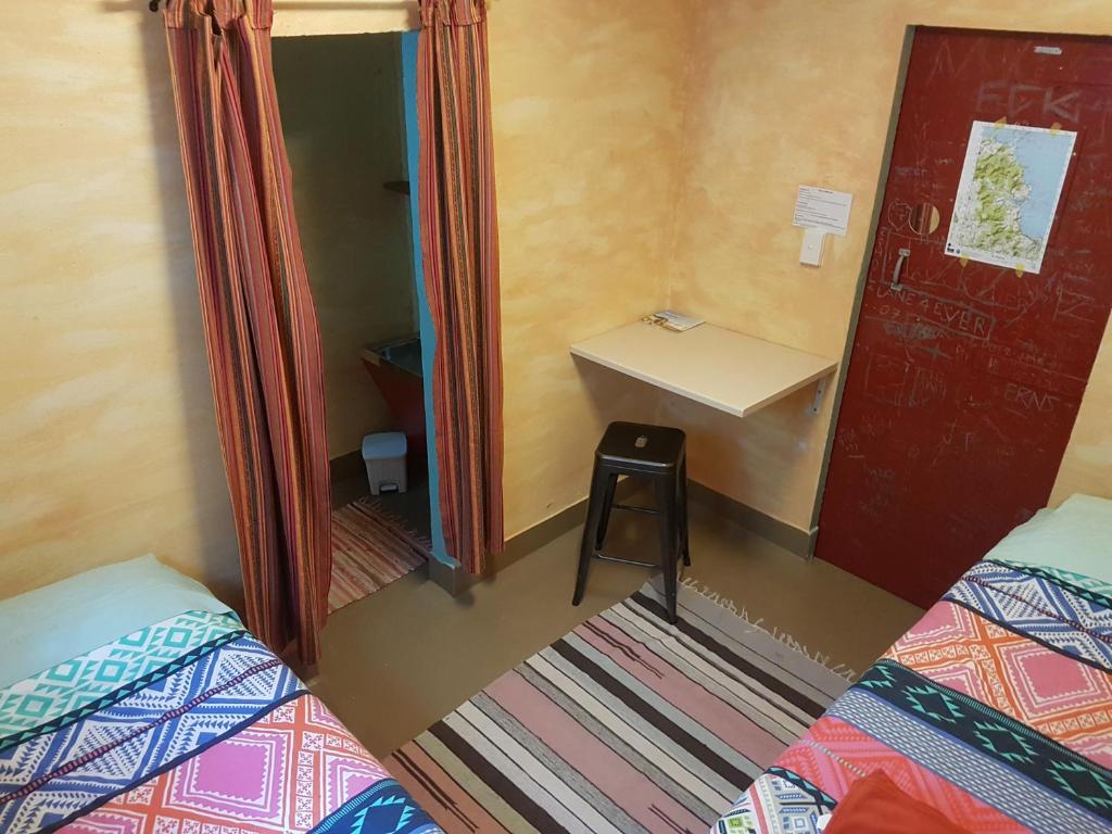 Postel nebo postele na pokoji v ubytování The Cell Block Backpackers