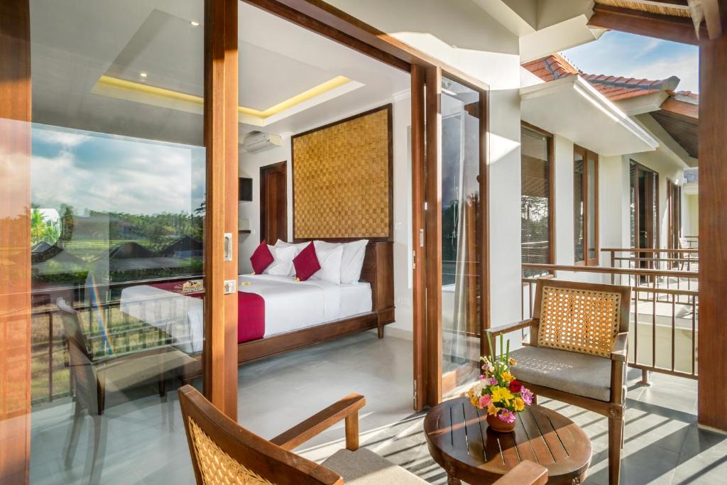 Postel nebo postele na pokoji v ubytování Bumi Muwa Ubud Katiklantang