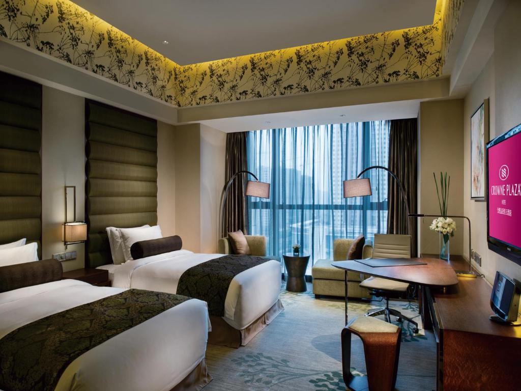 Postel nebo postele na pokoji v ubytování Crowne Plaza Hefei by IHG
