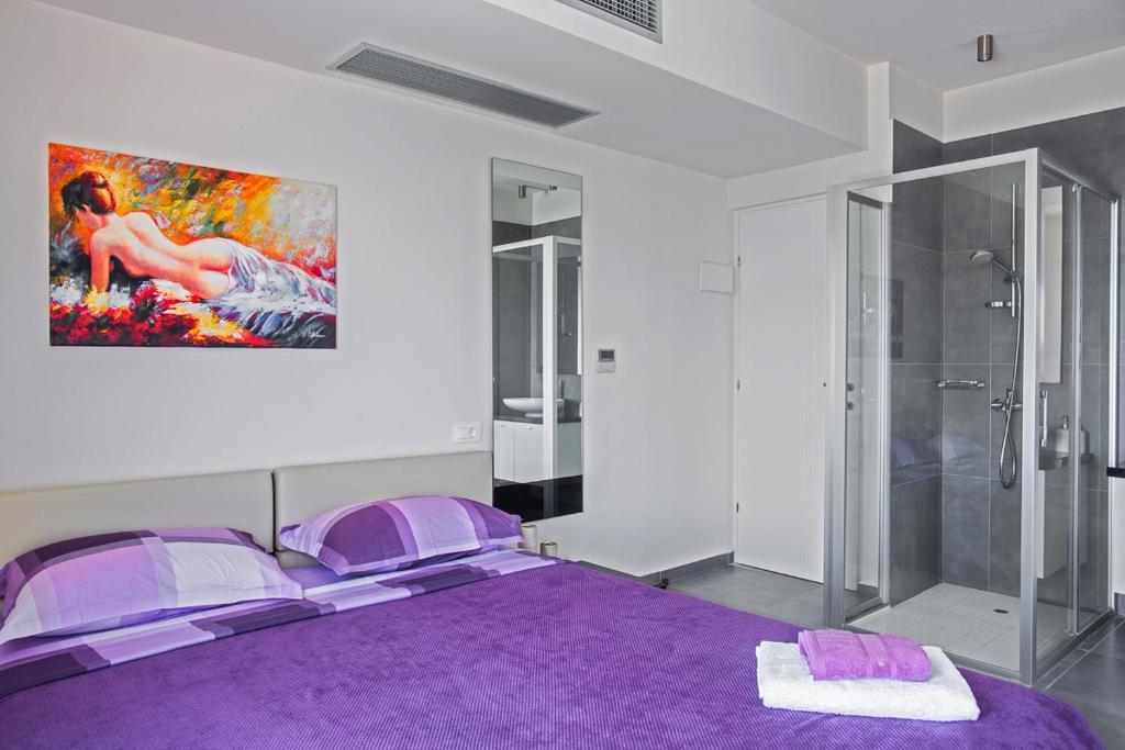 Postel nebo postele na pokoji v ubytování Villa Andrea