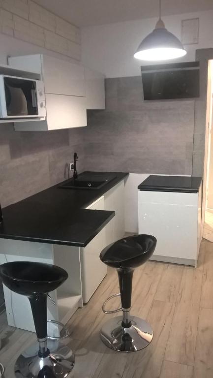 Kuchyňa alebo kuchynka v ubytovaní Apartamenty przy Starym Rynku