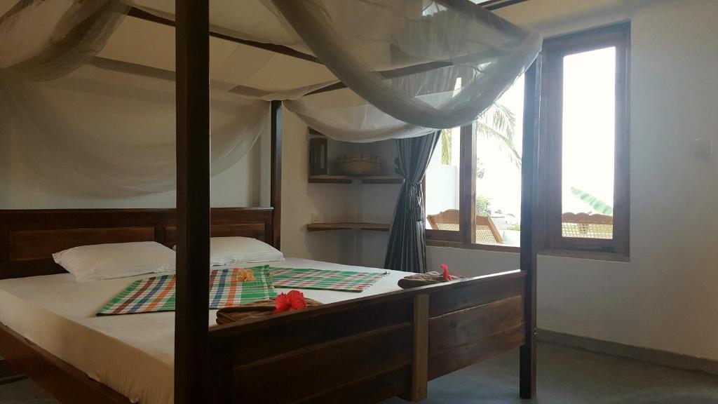 Postel nebo postele na pokoji v ubytování Cili Hotel