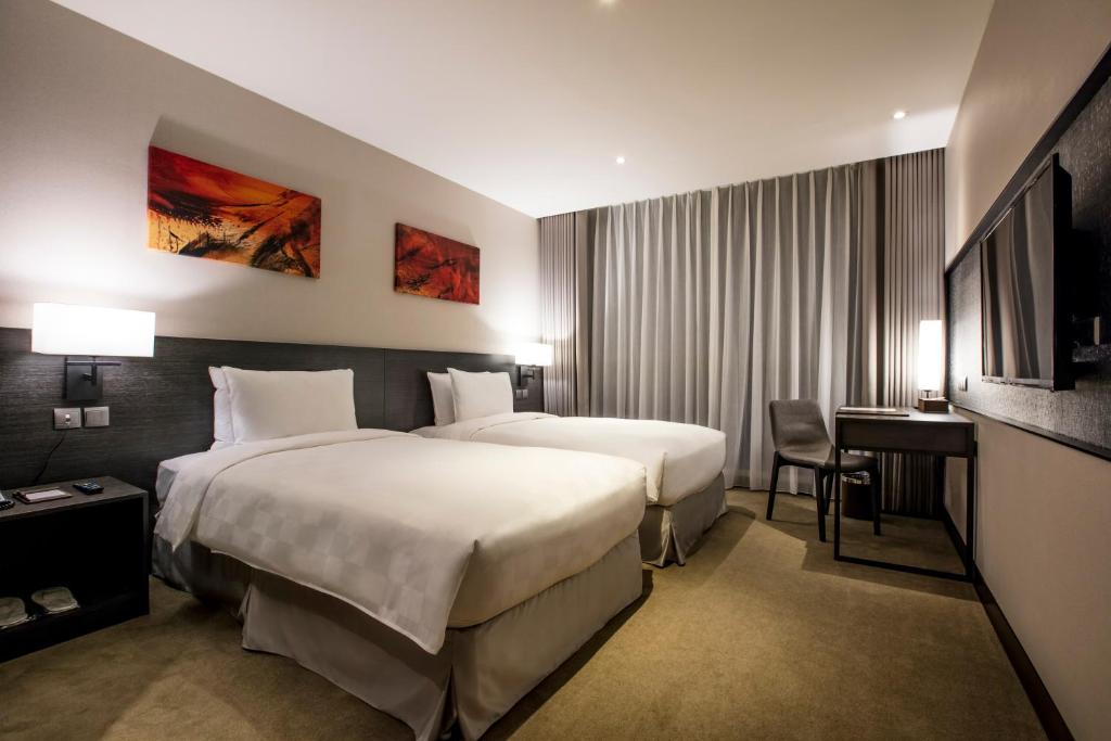 Postel nebo postele na pokoji v ubytování Platinum Hotel