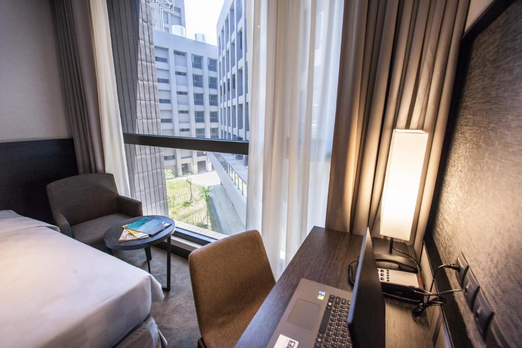 Postel nebo postele na pokoji v ubytování Platinum Hotel