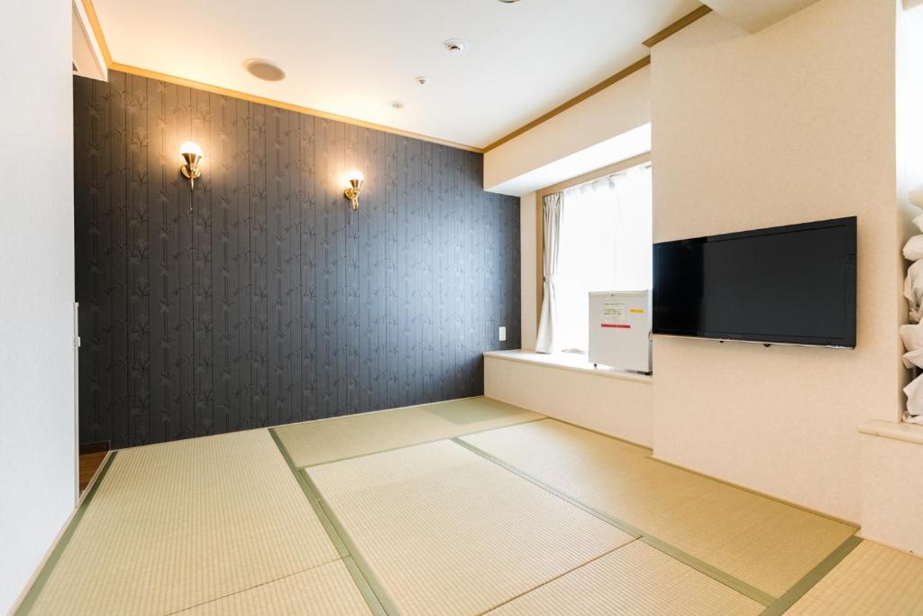 TV a/nebo společenská místnost v ubytování U-Community Hotel