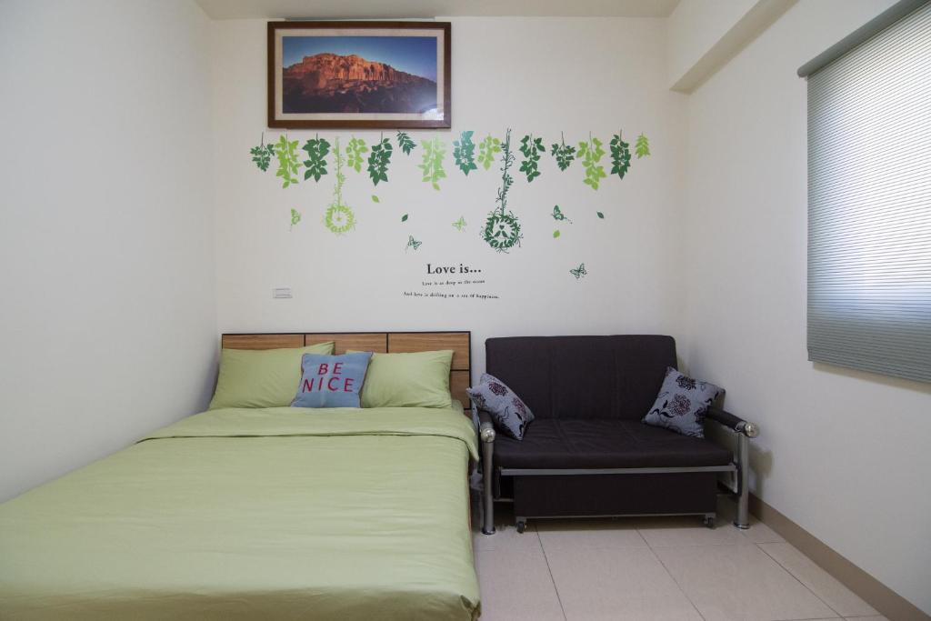 Postel nebo postele na pokoji v ubytování Gold Ya Homestay
