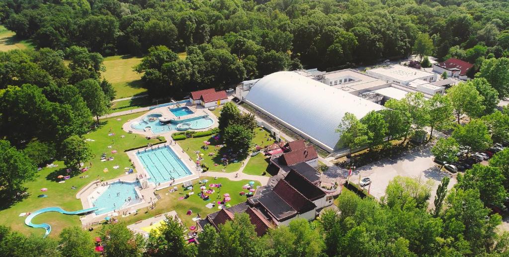 an overhead view of a large building with a swimming pool at Lifestyle Hotel Leithana in Bruck an der Leitha