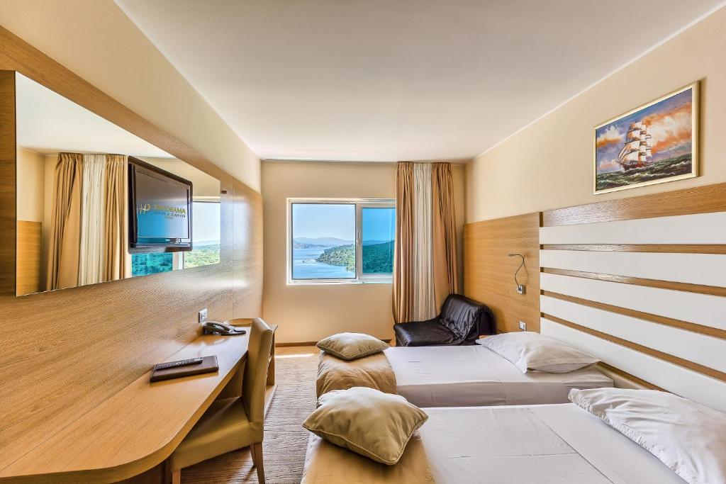 Postel nebo postele na pokoji v ubytování Hotel Panorama