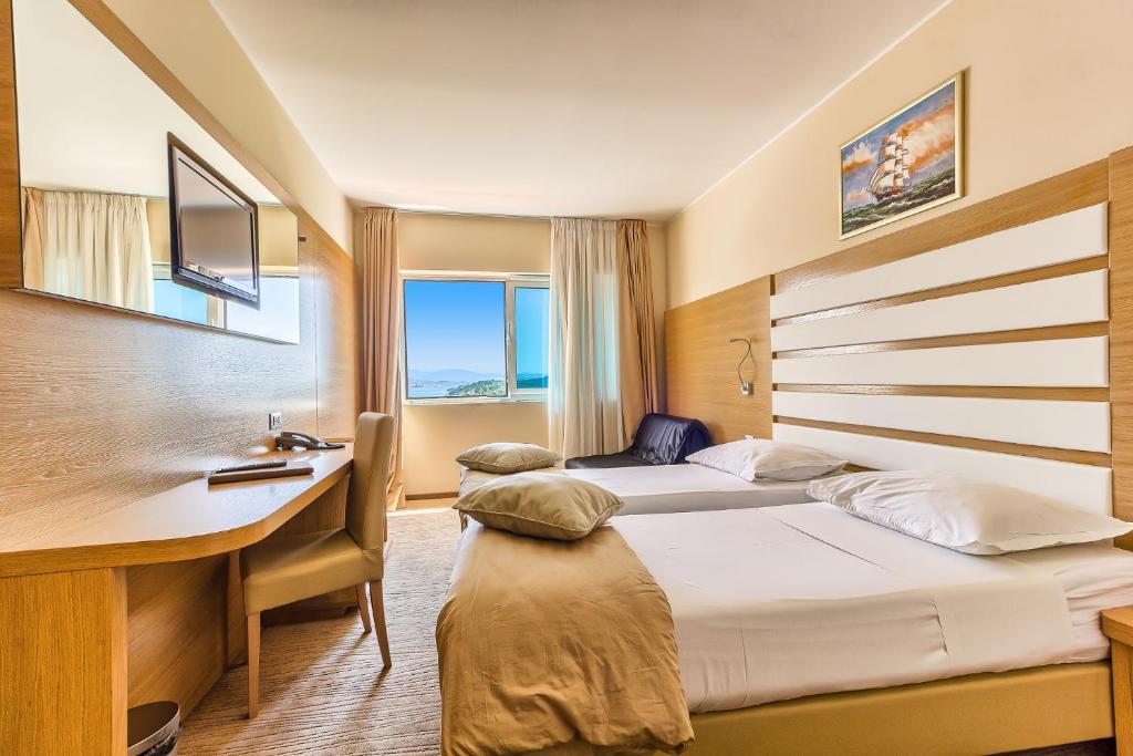 Postel nebo postele na pokoji v ubytování Hotel Panorama