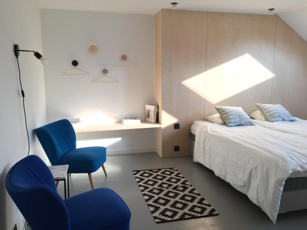 Postel nebo postele na pokoji v ubytování Canopée guesthouse