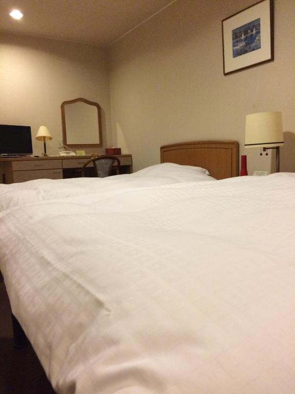 Postel nebo postele na pokoji v ubytování Hotel Park