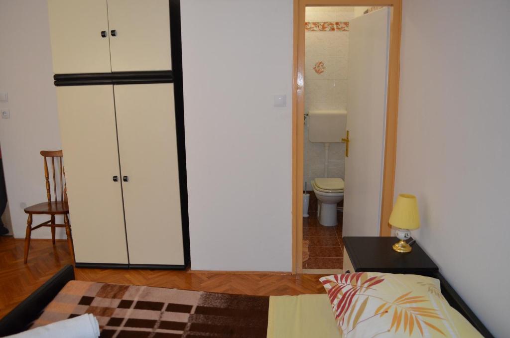 Postel nebo postele na pokoji v ubytování Apartments Antonio