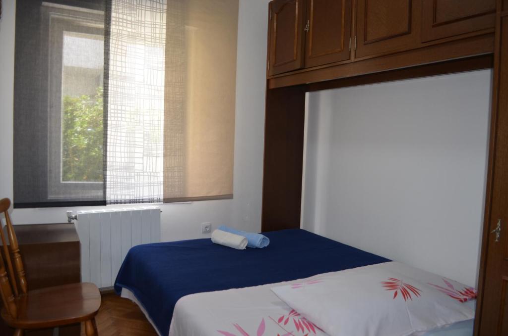 Postel nebo postele na pokoji v ubytování Apartments Antonio