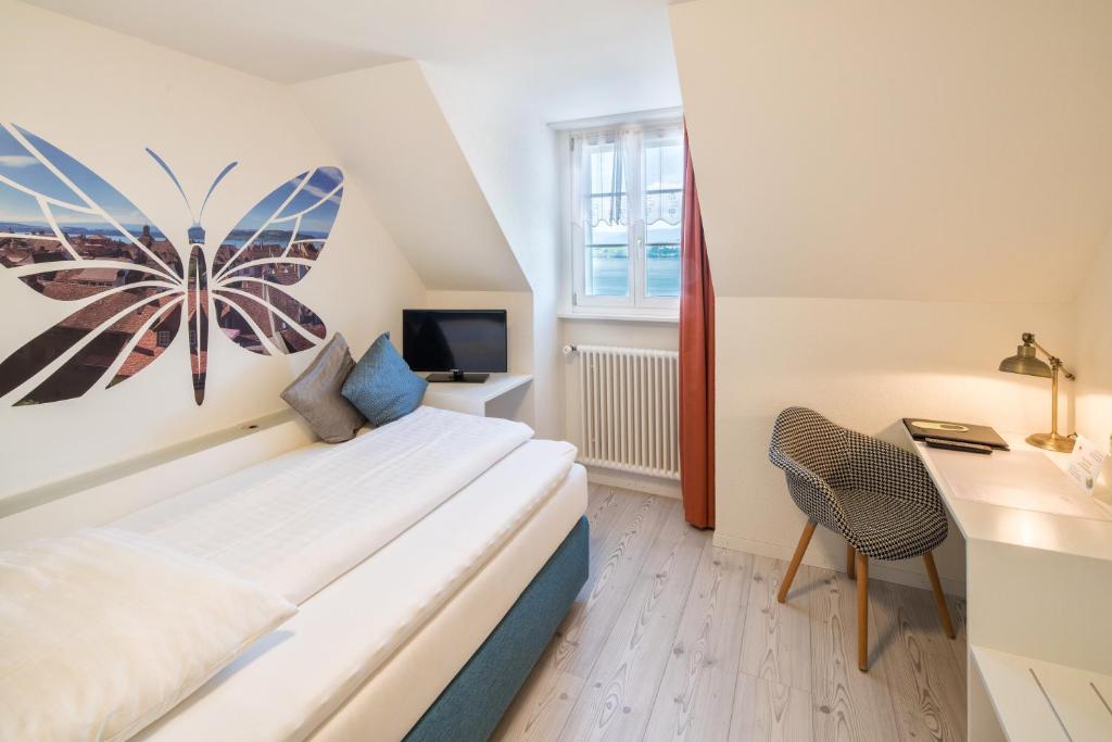 Postel nebo postele na pokoji v ubytování Hotel Murtenhof & Krone