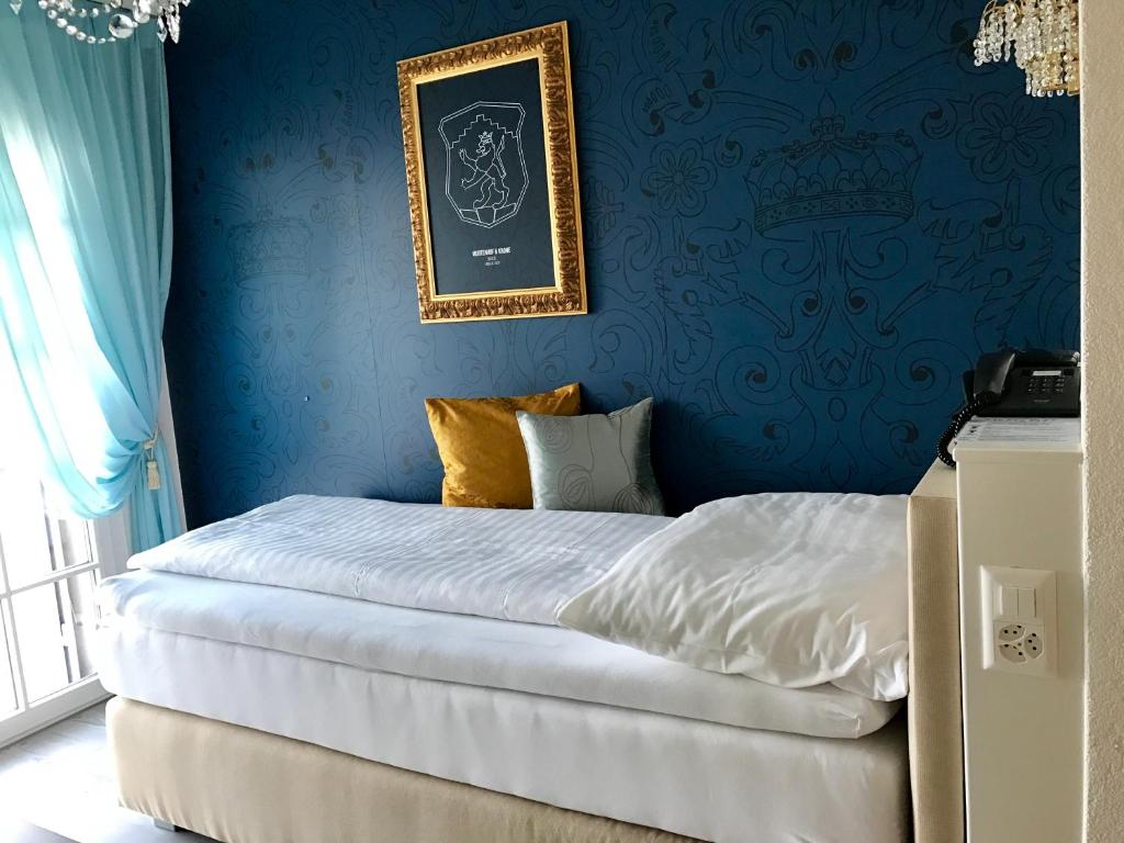 Postel nebo postele na pokoji v ubytování Hotel Murtenhof & Krone