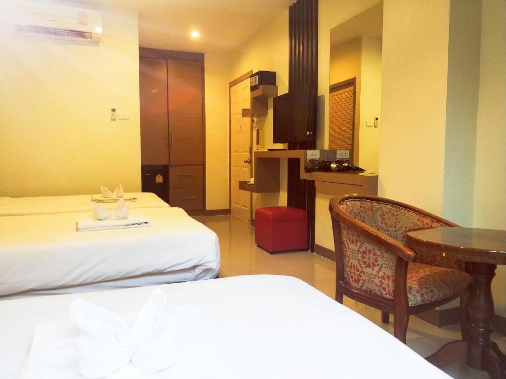 Postel nebo postele na pokoji v ubytování Pimrada Hotel