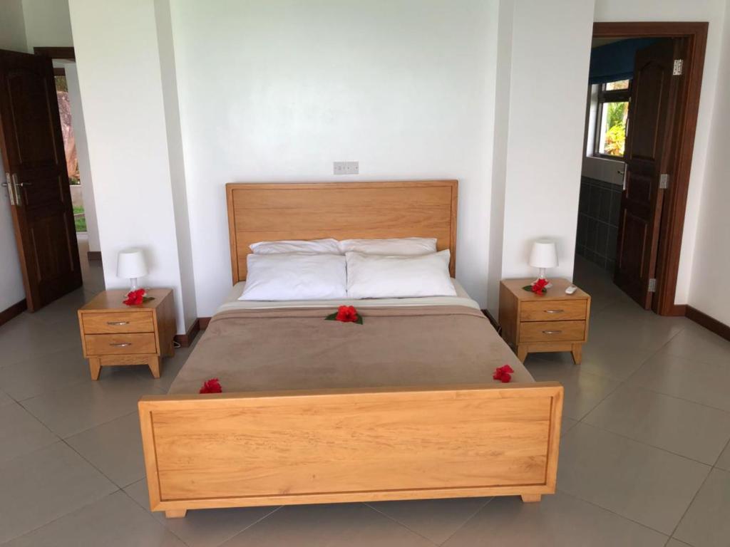 Postel nebo postele na pokoji v ubytování Sailfish Beach Villas