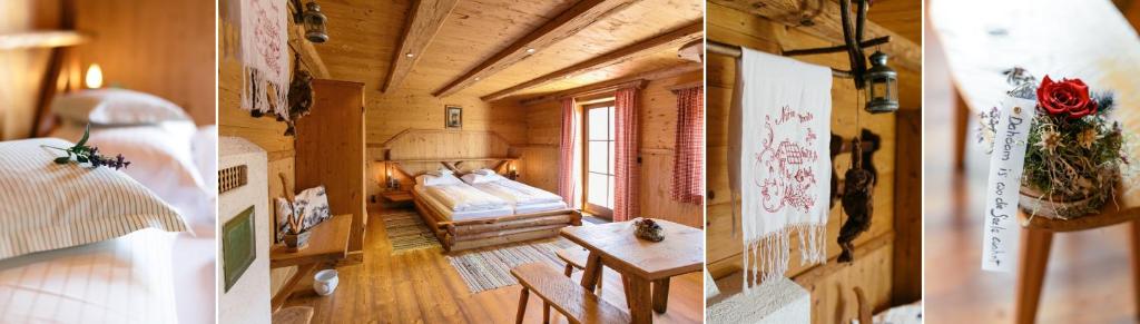 a bedroom with a bed and a table in a room at Seegasthof Gamsjaga in Sankt Gilgen