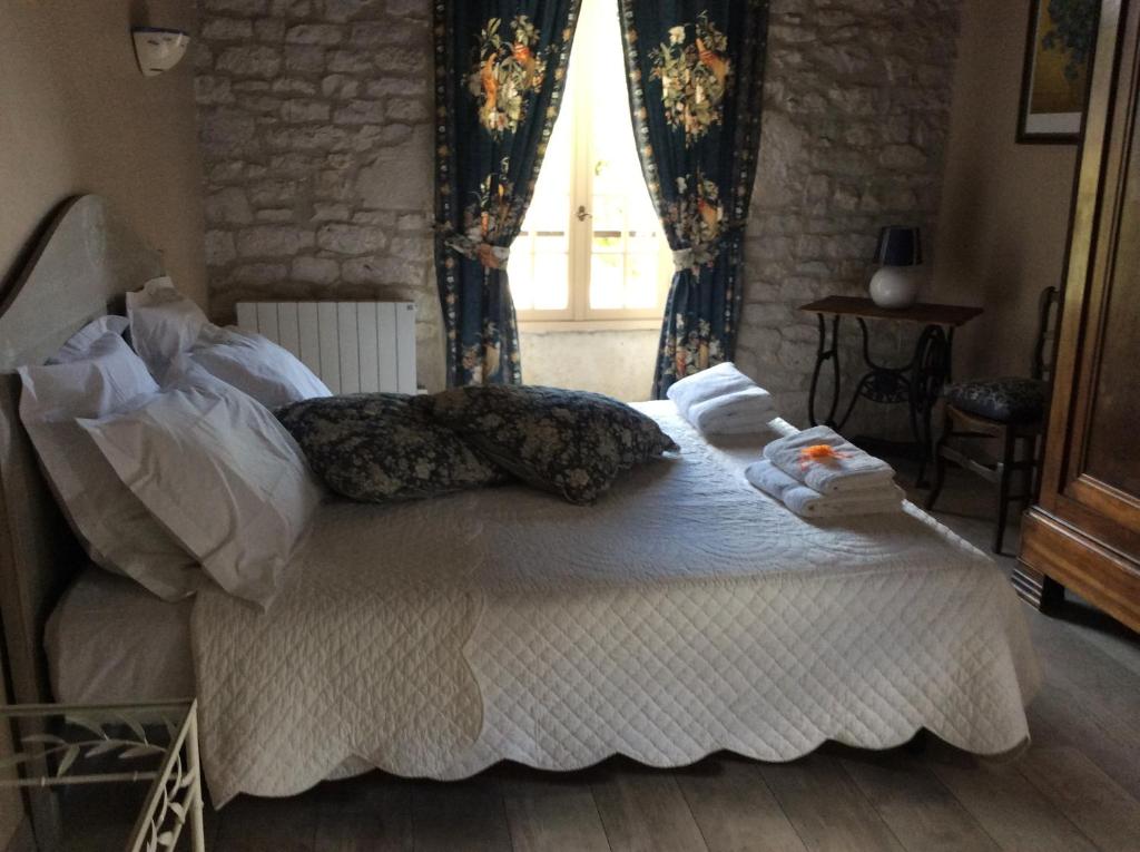 Postel nebo postele na pokoji v ubytování Chambre d'hotes la Quercynoise