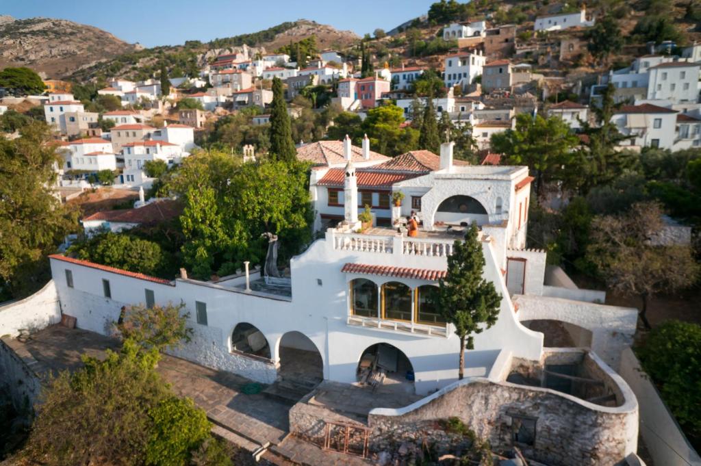 an aerial view of a large white house at Rallou House Hydra in Hydra