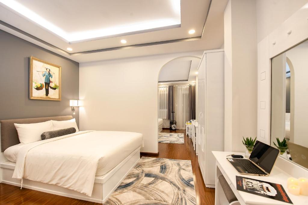 Postel nebo postele na pokoji v ubytování Adora Hotel