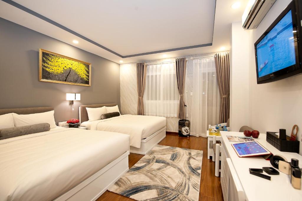 Postel nebo postele na pokoji v ubytování Adora Hotel