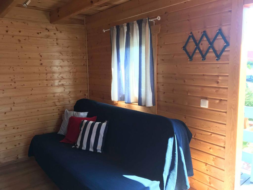 Postel nebo postele na pokoji v ubytování Domki Kapitańskie z prywatnym polem do gry w Mini Golf