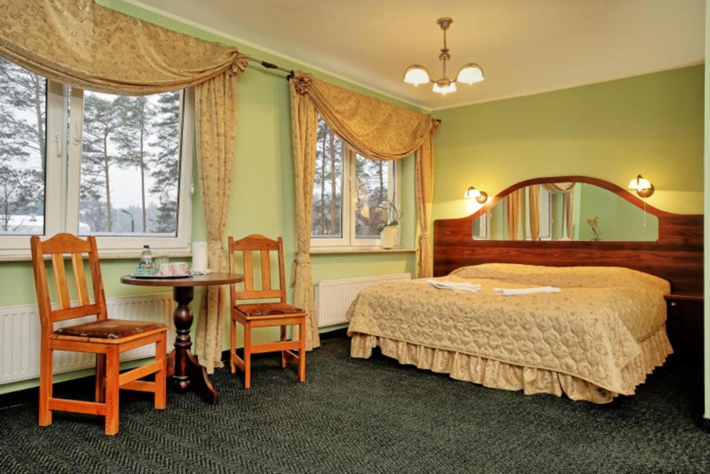 מיטה או מיטות בחדר ב-Best Inn
