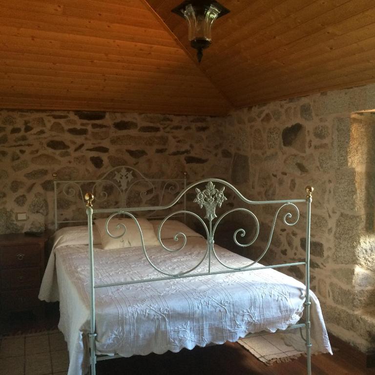 Postel nebo postele na pokoji v ubytování Refugio dos Cregos