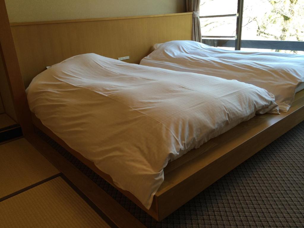 Postel nebo postele na pokoji v ubytování Hotel Park