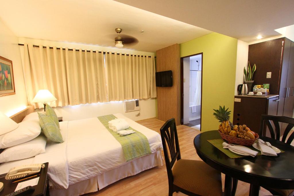 Postel nebo postele na pokoji v ubytování Hotel Fleuris