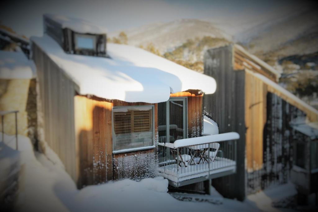 a balcony of a house covered in snow at CHILL-OUT - Thredbo in Thredbo