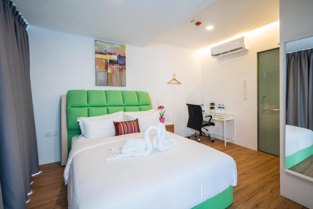 Postel nebo postele na pokoji v ubytování My Sj Hotel