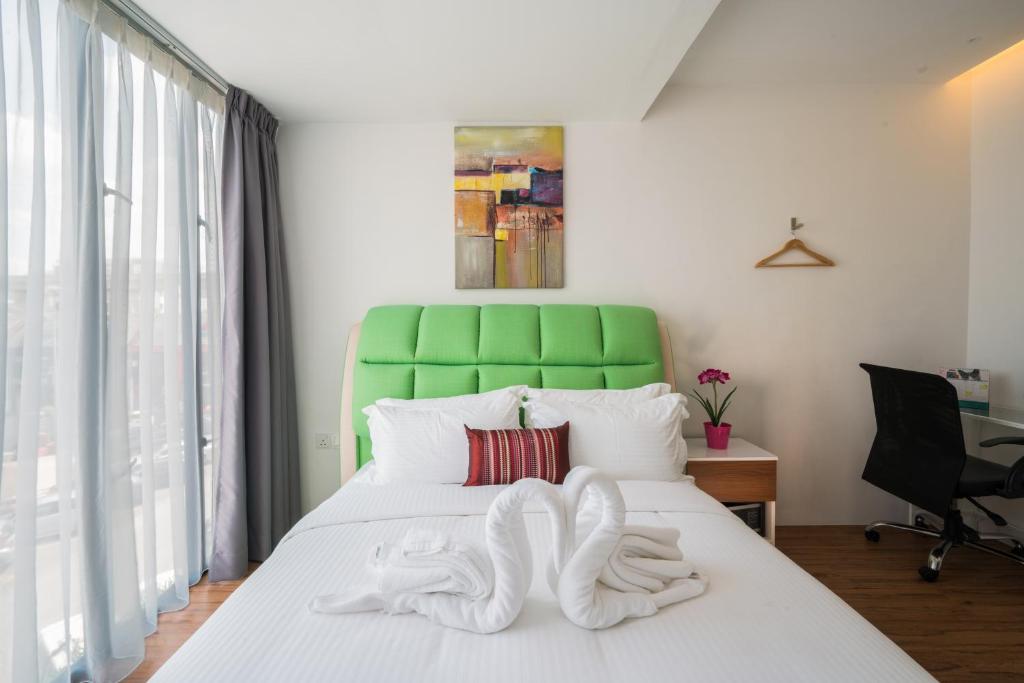 Postel nebo postele na pokoji v ubytování My Sj Hotel