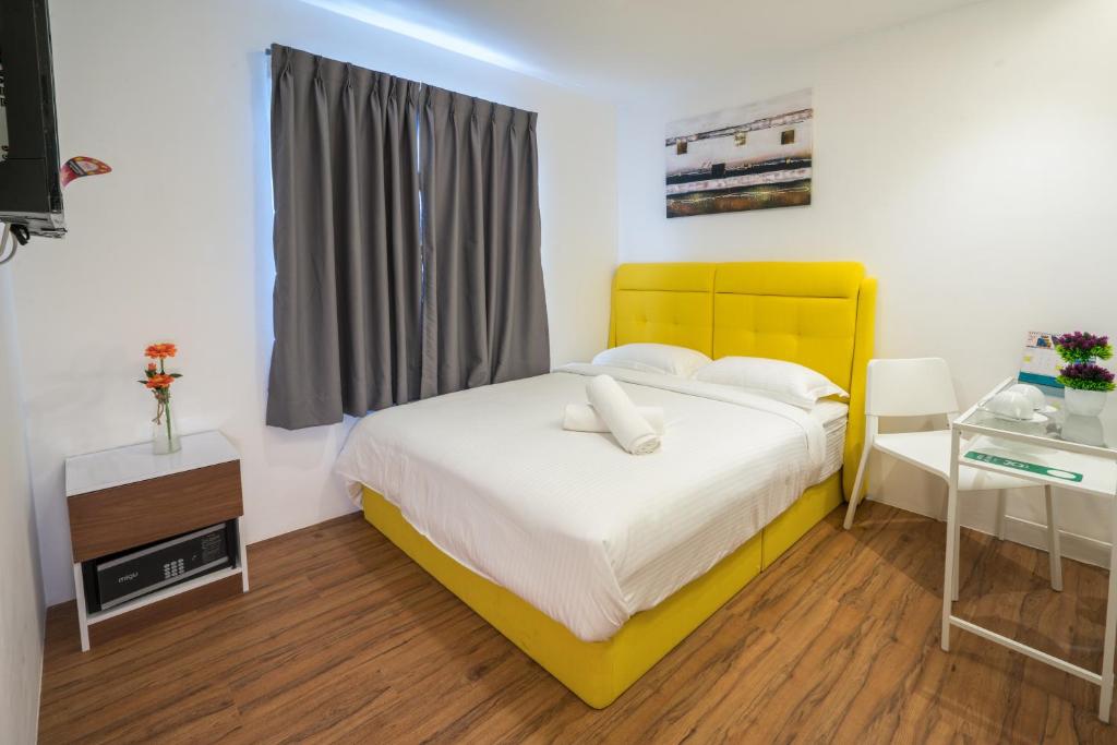 Postel nebo postele na pokoji v ubytování My Sj Hotel