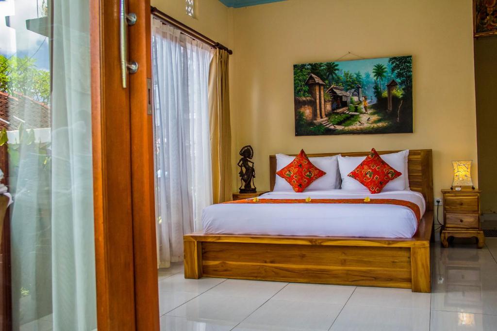 Postel nebo postele na pokoji v ubytování Kubu Loris Residence