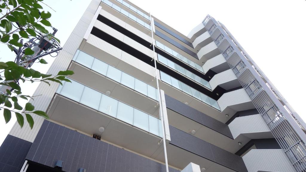 a tall building with a lot of windows at Bay Hotel Urayasu-ekimae in Urayasu