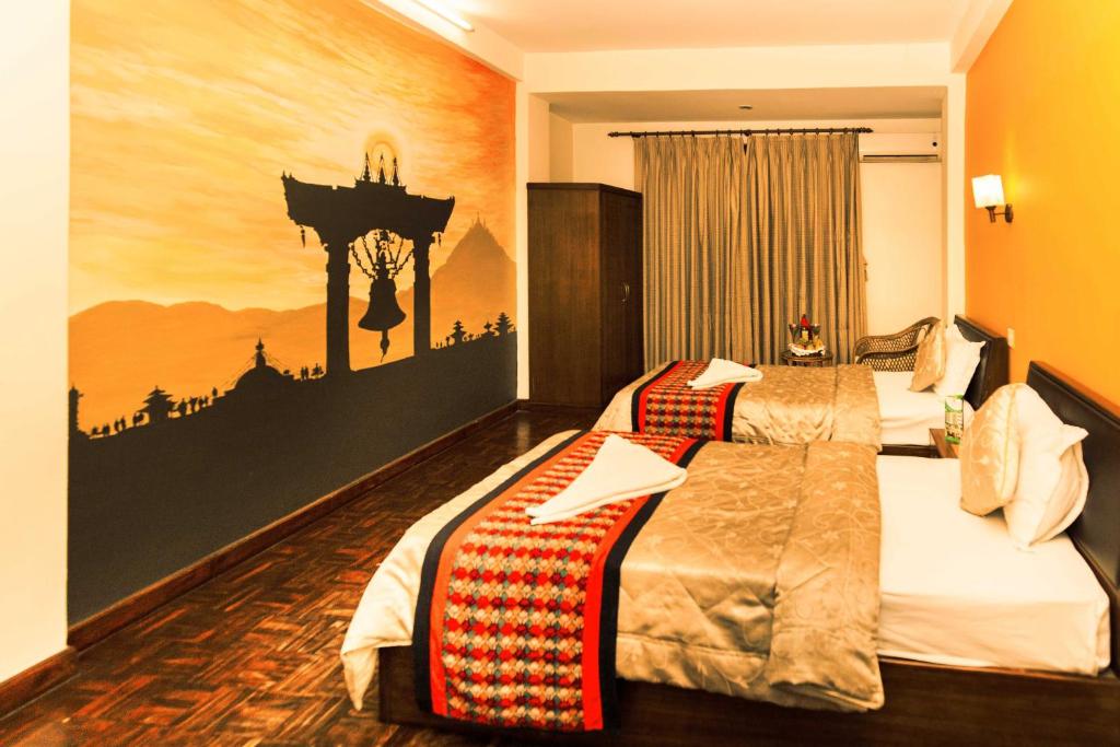 Postel nebo postele na pokoji v ubytování Kathmandu Eco Hotel