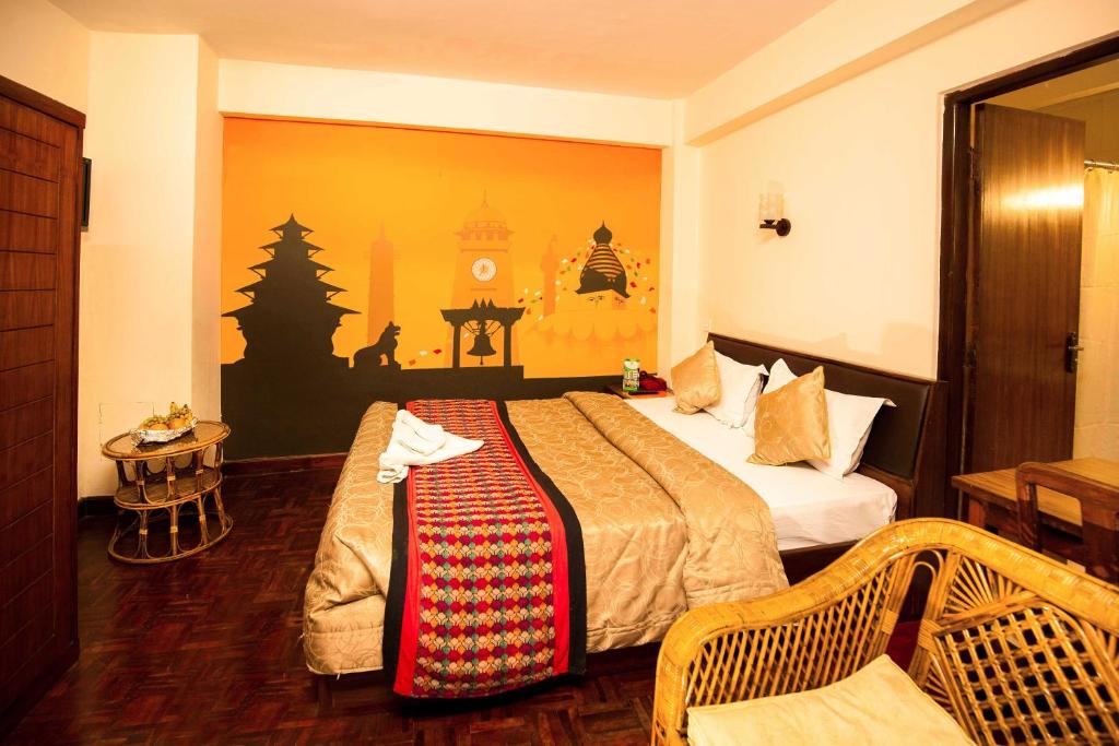 Postel nebo postele na pokoji v ubytování Kathmandu Eco Hotel
