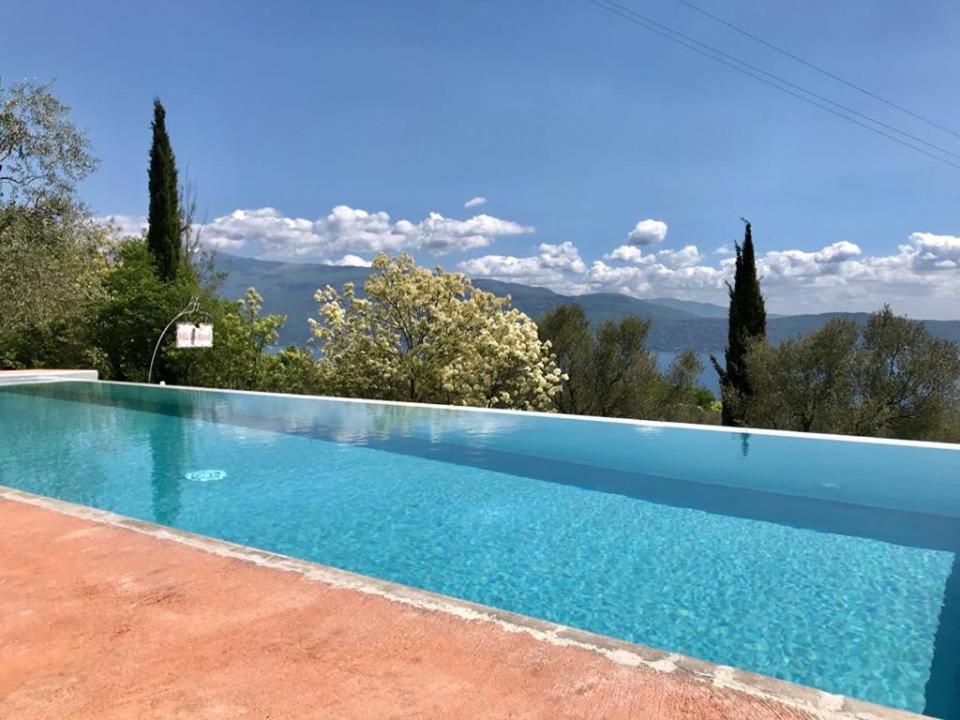 a swimming pool in a villa with a view at Caselli Vigole al Sole in Toscolano Maderno
