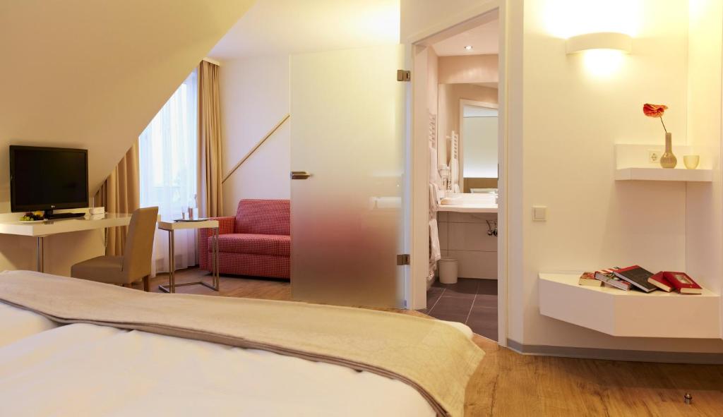 Postel nebo postele na pokoji v ubytování Landhotel Sonne