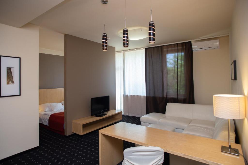 Postel nebo postele na pokoji v ubytování Hotel Laterum