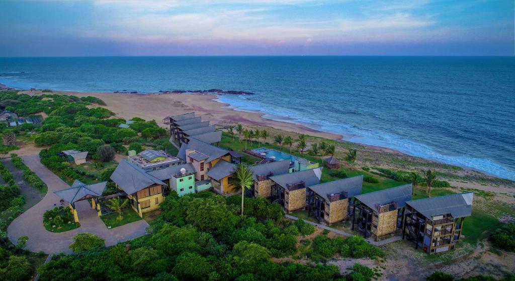 an aerial view of a house on the beach at Laya Safari Resorts & Spa in Yala