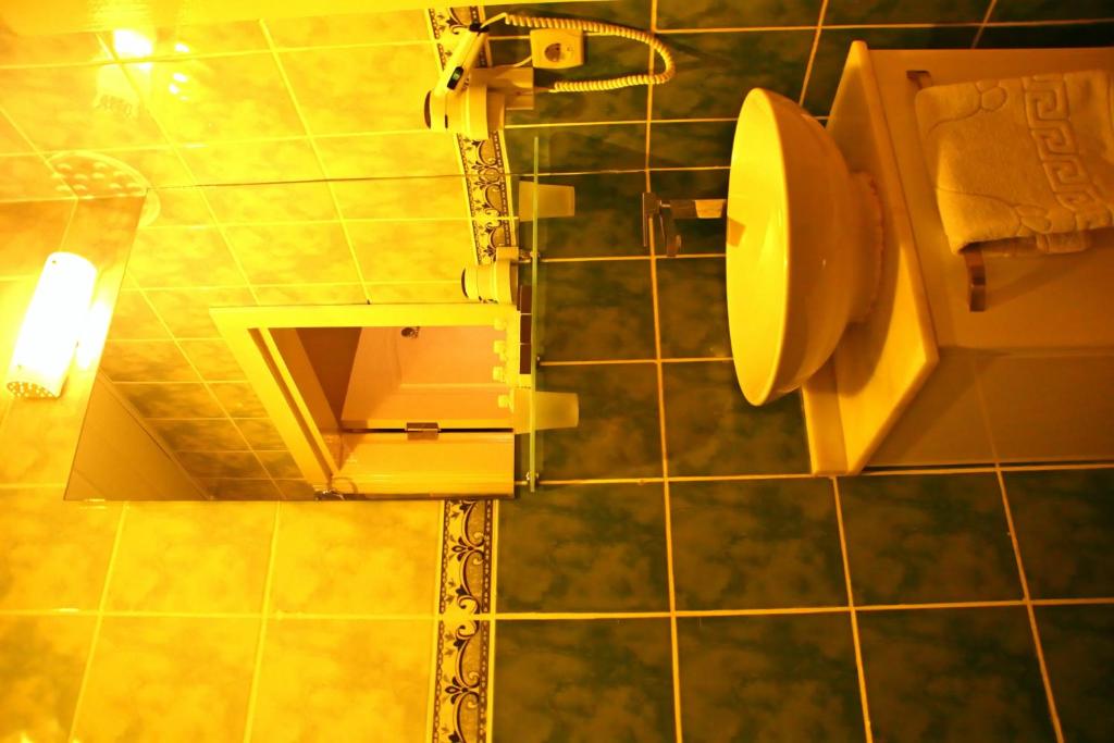 Koupelna v ubytování Divas Hotel